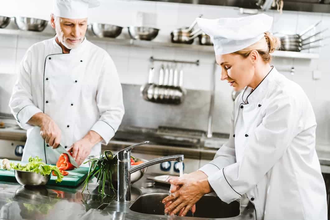 chef washing hands to prevent food contamination