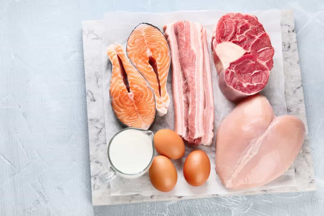 How Should Raw Animal Proteins be Stacked Prior to Cooking